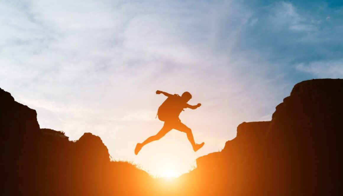 Man jump through gaps between hills