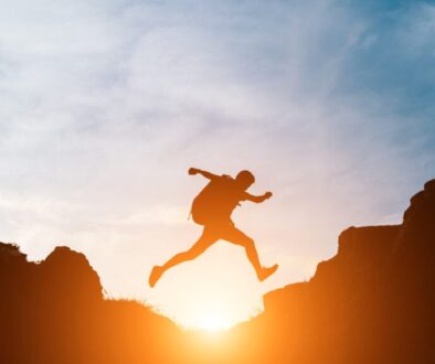 Man jump through gaps between hills