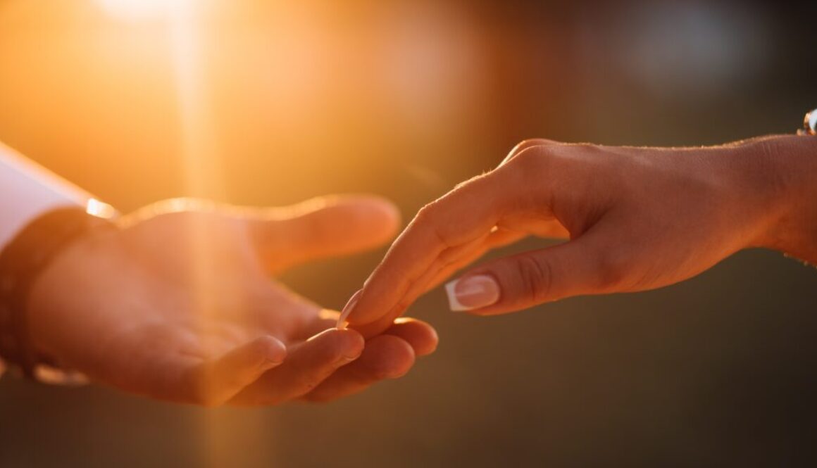 Newlyweds hands affectionate touch each other